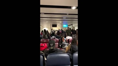 UK: Passengers React In Dismay At Flight Cancelation Announcement At Gatwick Stock Footage 198886205