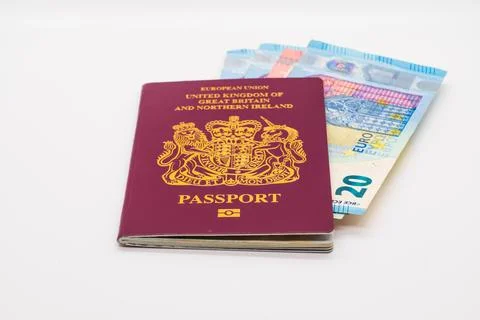 UK passport with Euro notes inside isolated on a white background Stock Photos