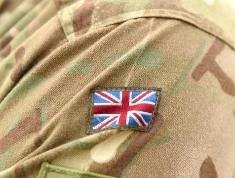UK patch flag on soldiers arm. UK military uniform. United Kingdom troops Stock Photos