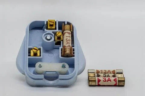 A UK plug with 3 different rated fuses Stock Photos