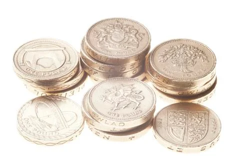 UK Pound coin currency stack on white background. Fotos de archivo