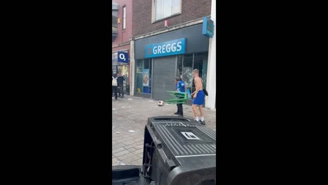 UK: Shops looted and set on fire following Southport Tragedy Stock Footage 281083046