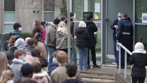UK: Students queue for antibiotics at the University of Kent in Canterbur... Stock Footage 330895617