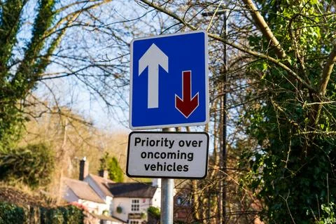 UK Traffic sign stating lane priority on a  blue rectangle Stock Photos