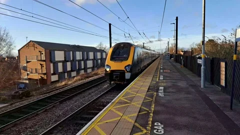 UK Trains watched from the platform. Stock Footage 233830117