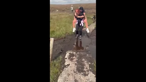 UK: Two women fall into deep mud while crossing path in Somerset, UK Stock Footage 344514504