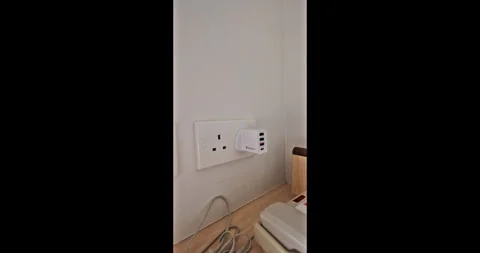 UK wall socket with multi-port USB charger adapter Stock-Footage 347997613