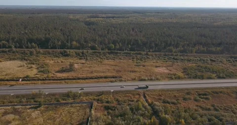 Ukraine from above: highway surrounded by fields and forest Stock Footage 345370650