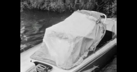 Ukraine - circa 1970s: man preparing a motorboat on a river bank in the USSR Vídeos de archivo 325907635
