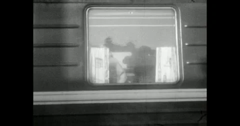 Ukraine - circa 1970s: Passengers looking out of a Soviet train window, USSR Stock Footage 337159934