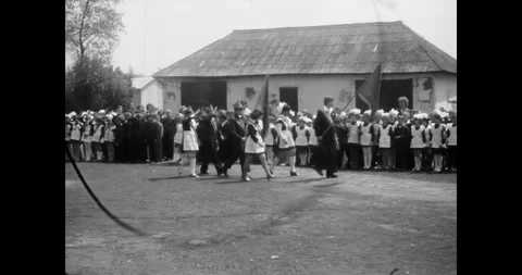 Ukraine - circa 1970s: Soviet school children in uniforms at an outdoor ceremony Stock Footage 333595242