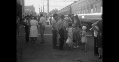 Ukraine - circa 1970s: Soviet Union train station platform, vintage black white Stock Footage 337159869