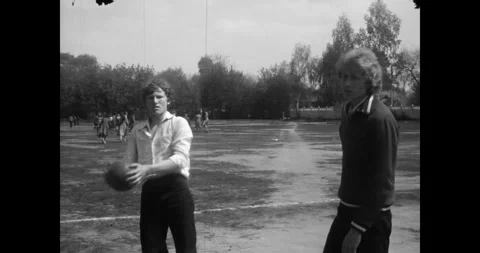 Ukraine - circa 1970s: Students playing with a ball on a school stadium Video stock 333586911