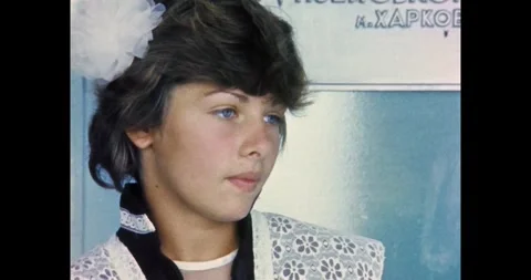 Ukraine - circa 1980s: Solemn Soviet Schoolgirl in Uniform Stock Footage 323390199