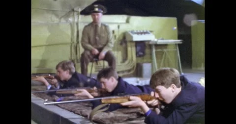 Ukraine - circa 1980s: Soviet Instructor Teaches Young Students Rifle 動画素材 318067611
