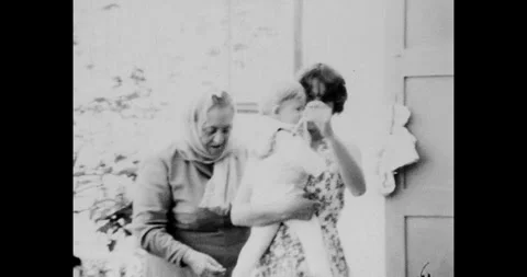 Ukraine - circa 1980s: Three Generations Family Walking Outside a House in Vídeo Stock 320674533