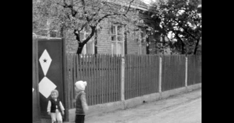 Ukraine - circa 1980s: Two Small Children Running and Playing Outdoors on a Vídeos de archivo 320074260