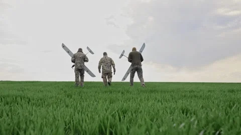 Ukraine Circa spring 2023 - Three soldiers are preparing to launch drones in a Stock Footage 240101918