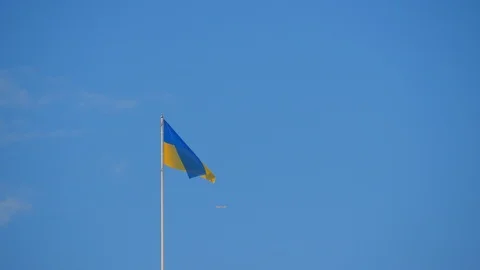 Ukraine flag on a background of blue sky. Stock Footage 117937398