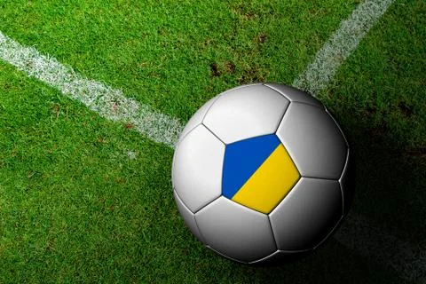 Ukraine flag pattern of a soccer ball in green grass Stock Illustration