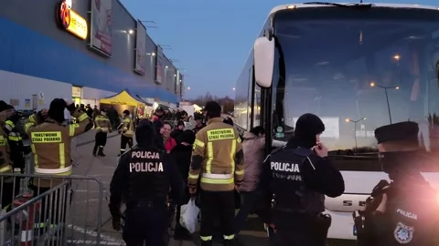 Ukraine Refugees at Reception Center Loading Onto Buses in Poland Stock Footage 221123204