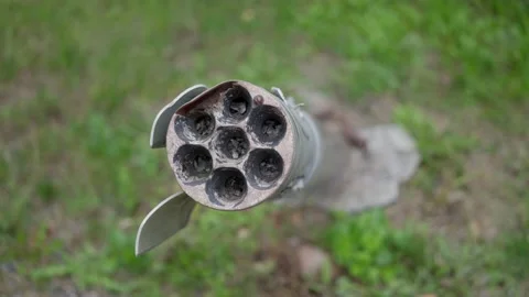 Ukraine war. Close-up view of unexploded military missile, shell stuck in ground Stock Footage 217931514