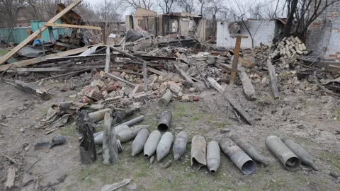 Ukraine war. Close-up view of unexploded military missile, shell stuck in ground Stock Footage 244049008