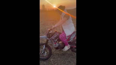 Ukraine: Woman loses control while practicing on dirt bike in Huta, Rivne... Stock Footage 331887805
