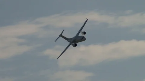 Ukrainian aircraft An-148 performs horizontal flight with right turn. Stock Footage 107584284