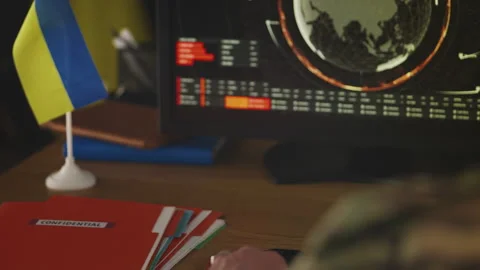 Ukrainian army general working with satellite data while planning mission Stock Footage 335537894