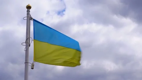 Ukrainian banner wave on the background of cloudy, dramatic sky. Stock Footage 183304364
