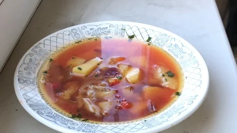 Ukrainian borsch in a white plate with a pattern. 動画素材 95650154