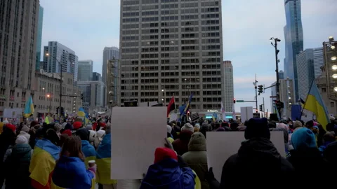 The Ukrainian demonstration with flags and placards against russian invasion on Stock Footage 310430336