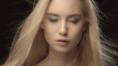 Ukrainian fashion model face closeup isolated on black background. Beautiful Stock Footage 71761844