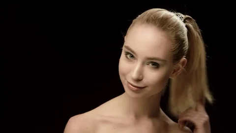Ukrainian fashion model face closeup isolated on black background. Beautiful Stock Footage 71761852