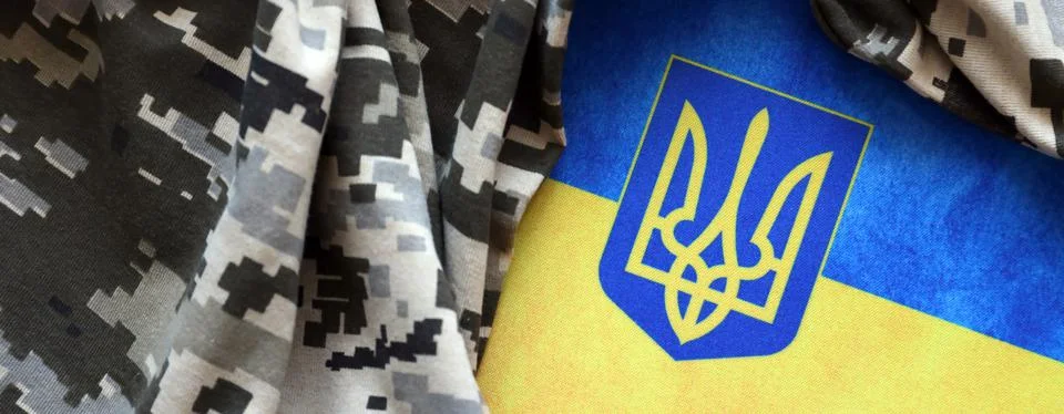 Ukrainian flag and coat of arms with fabric with texture of pixeled camouflag Stock Photos