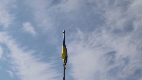 Ukrainian Flag on the Background of the Blue Sky in Zhytomyr during the War. Stock Footage 170998384