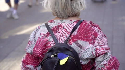 Ukrainian flag. On the backpack hangs a heart with the flag of Ukraine. Stock Footage 232966576