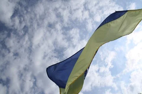 Ukrainian flag on a cloudy sky Stock Photos