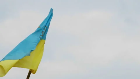 The Ukrainian flag on the flagpole flutters in the wind. 4K, slow motion Video stock 175820226