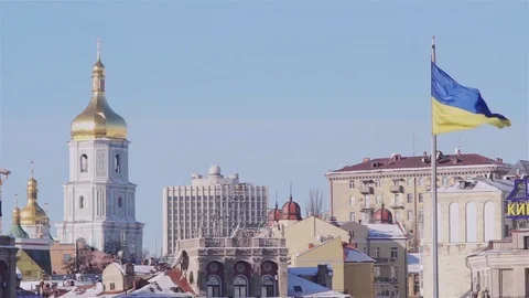 Ukrainian flag floating with a bell tower on the background Stock Footage 72167410