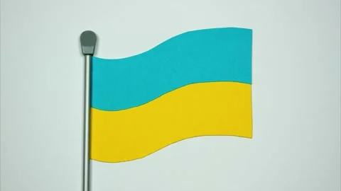 The Ukrainian flag flutters on white background. Paper stop motion animation Stock Footage 172078747