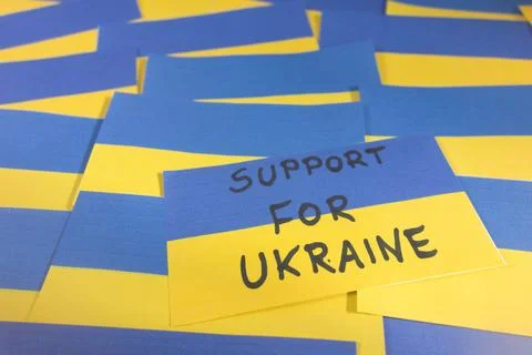 Ukrainian flag with handwritten text support for Ukraine Stock Photos
