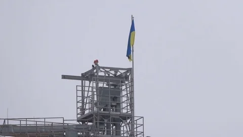 Ukrainian flag on industrial construction. Stock Footage 70352216