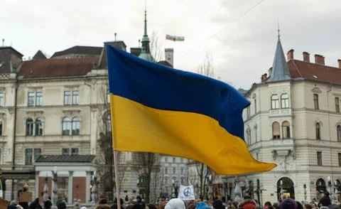 Ukrainian flag over demonstration to support Ukraine Stock Photos