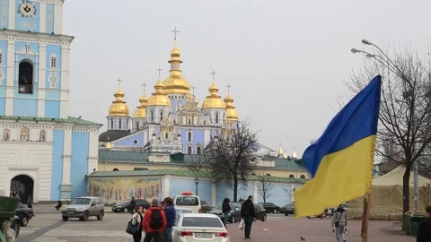 Ukrainian flag at protest camp in front of St. Michael's Golden-Domed Monastery Stock Footage 203869565