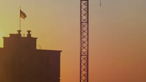 Ukrainian flag at sunset flutters in the wind. State torn flag of Ukraine Stock Footage 116296454