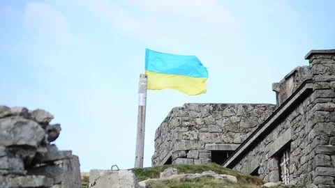 Ukrainian flag on the top of the mountain Stock Footage 70560317