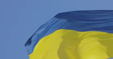 Ukrainian flan in the wind close-up. The flag of Ukraine flutters in the wind 動画素材 277623269