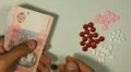 Ukrainian Hryvna UAH, Counting Drugs and Money, Health Care, Colorful Pills HD Footage